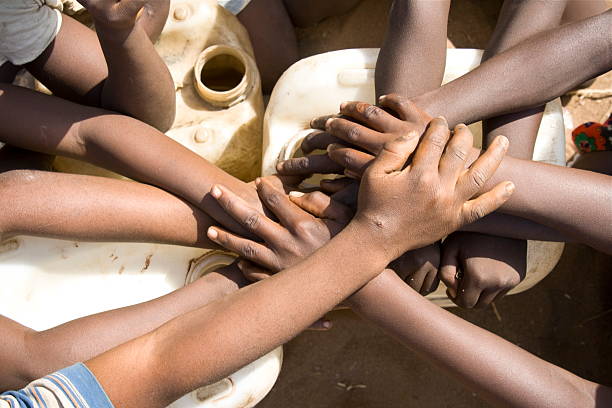 istock Africa children's Hands over water jugs 174638663