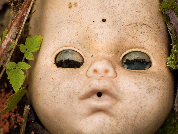 istock Doll head in the woods 174639131