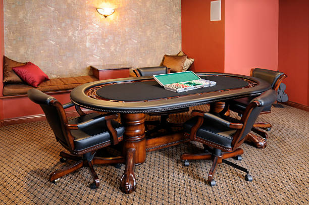 Carpeted Game Room With Poker, Cards Table, Chairs, Brown, Hardwood "Poker and gambling have become so much a part of modern culture, that home poker tables are becoming a popular part of family recreation and game rooms." nook architecture photos stock pictures, royalty-free photos & images