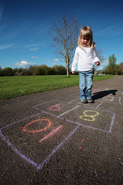 istock Hopscotch Girl Park 174640004