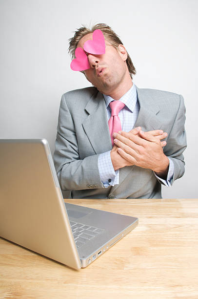 istock Lovestruck Businessman Holds Heart 174640088