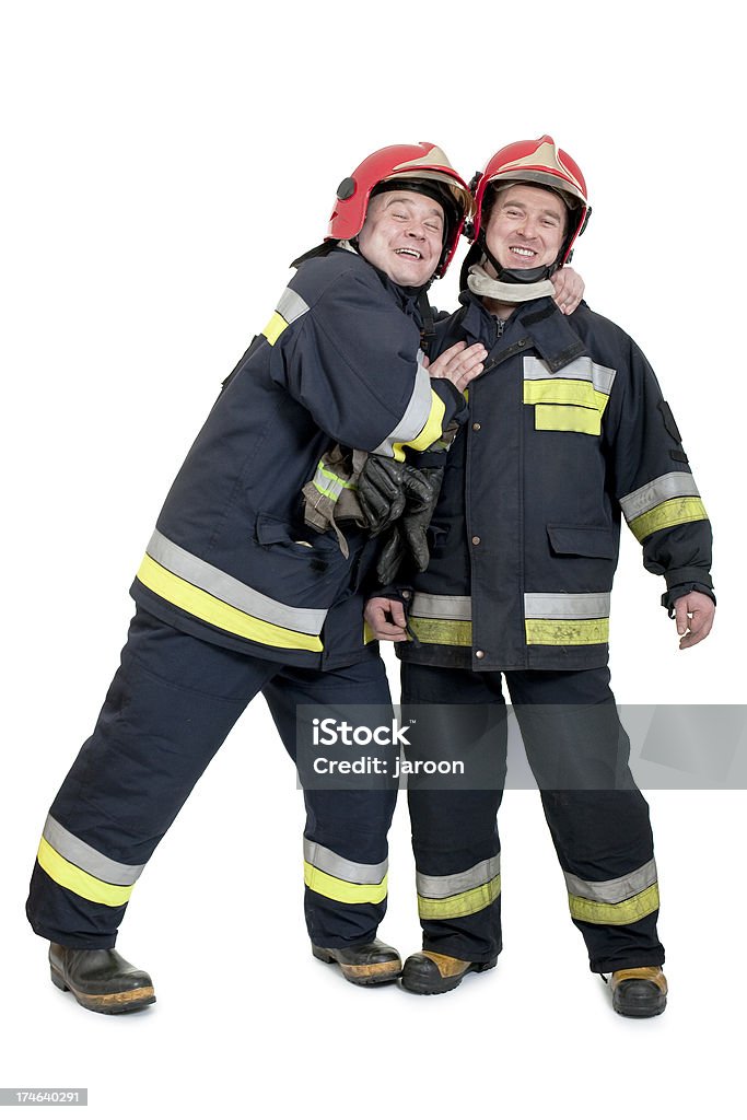 two firemen two firemen isolated on white Firefighter Stock Photo