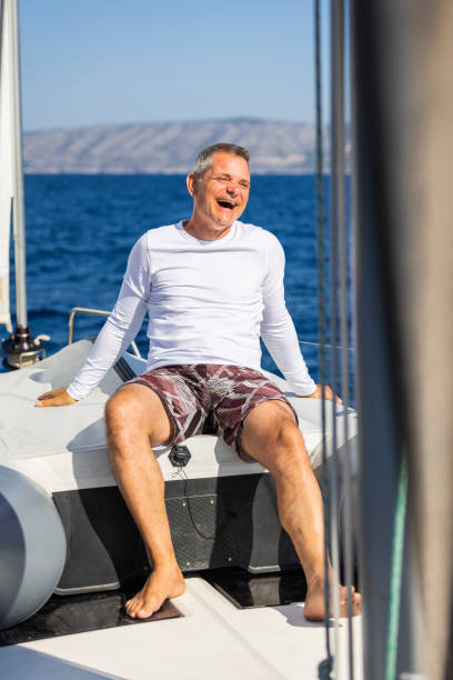 istock Crew member enjoying sailing on sailboat 1746411735