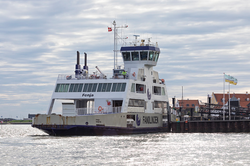 Fanø, Denmark - September 26, 2023: Ferry FENJA, operated by Molslinjen A/S, at the port of Nordby on the Danish North Sea island