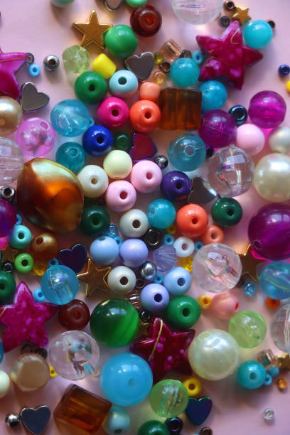 istock Colorful Beads on Pink Background 1746442184