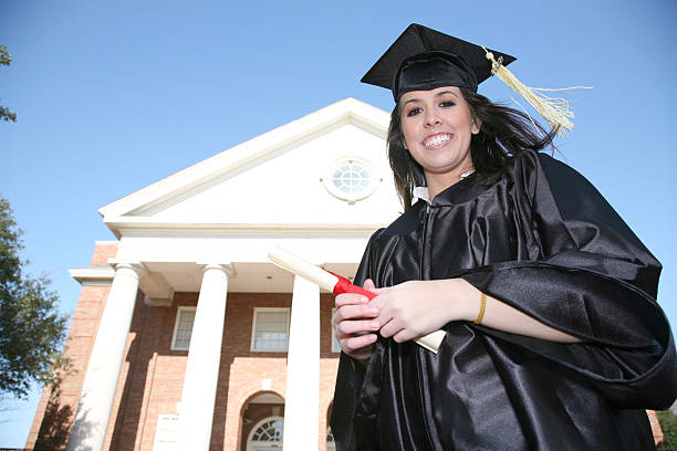istock Female Graduate at school, with copyspace 174645726