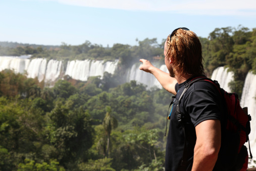 Man Pointing the Iguacu Waterfalls, Argentina