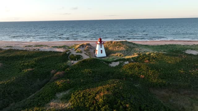 Aerial footage of St. Peter's Bay Lighthouse at sunset