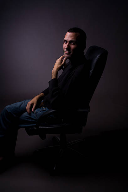 istock Powerful man sitting with hand on chin 174646743