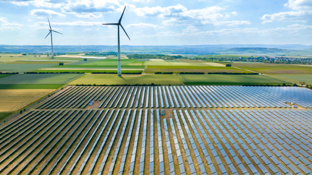 istock Wind turbines and solar park - aerial view 1746473514