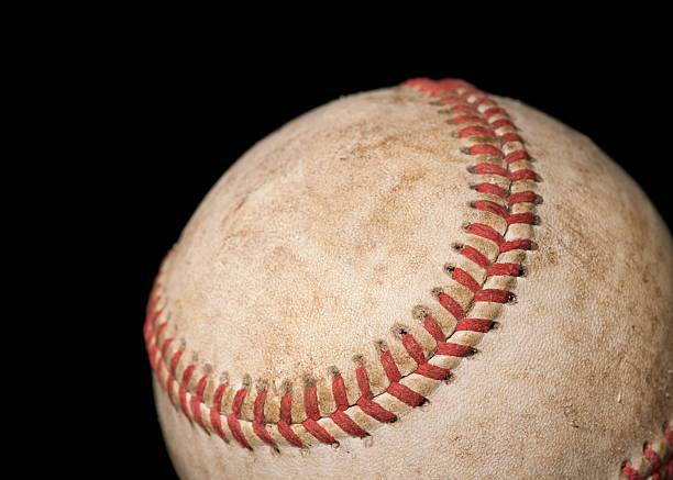 Worn Baseball on Black stock photo