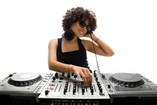 A cute curly haired woman Djing.