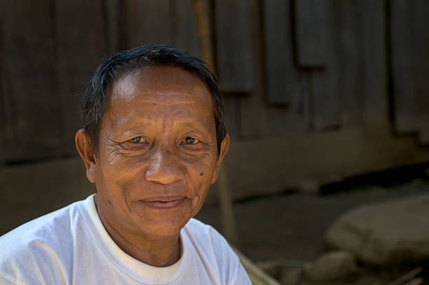 Hmong Amputee Hmong hill tribe man who is an amputee after having his leg blown off by a land mine on the Laos/Thailand border. Click the link below to see more of my Hmong photos and video miao minority stock pictures, royalty-free photos & images