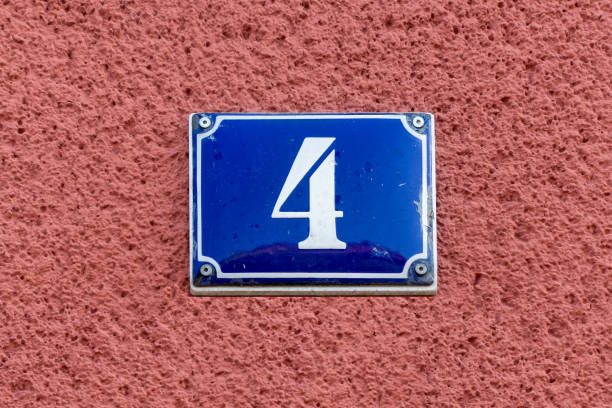 istock House address - number 4 on a blue enamel sign. 1746489917
