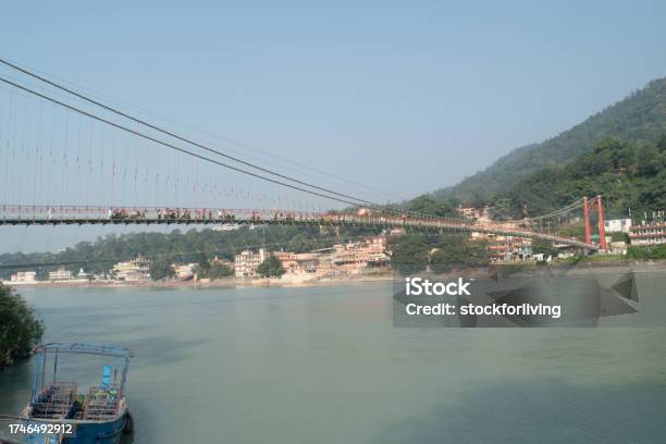 Ram Jhula Bridge View With Holy Ganga And Mountain At Rishikesh Stock Photo - Download Image Now