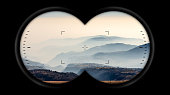 Binoculars Point of View with Hills and Padana Plain with Fog - Italy