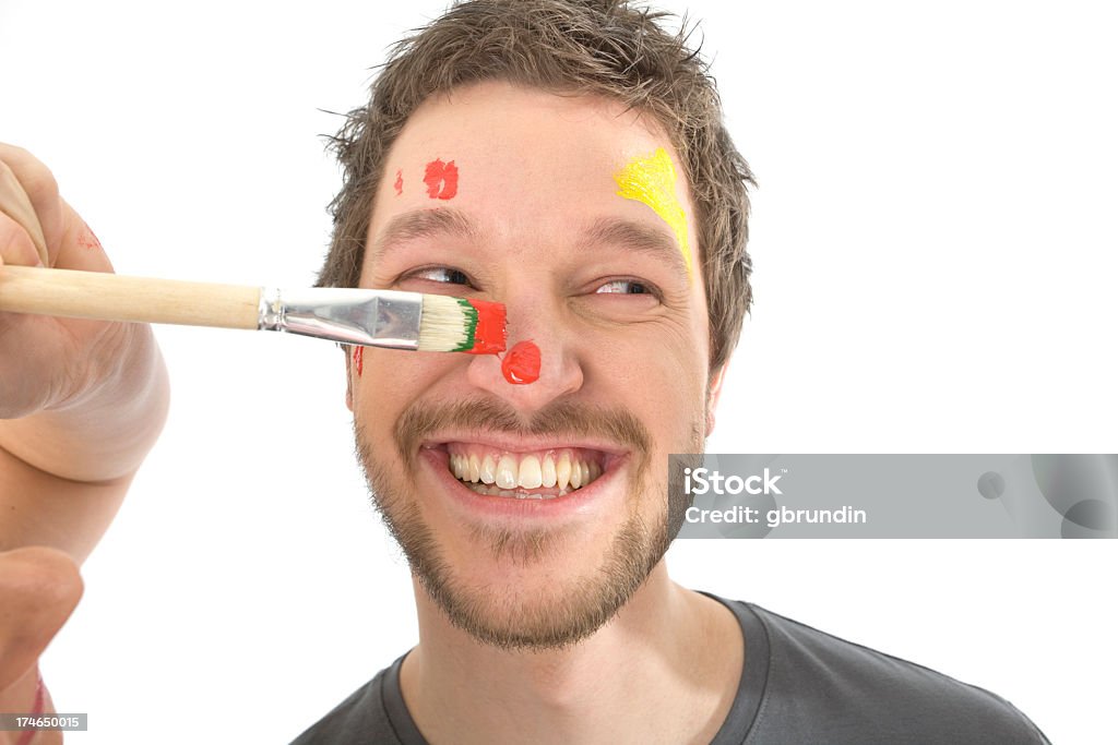 Face painting A man getting paint in his face. 20-24 Years Stock Photo