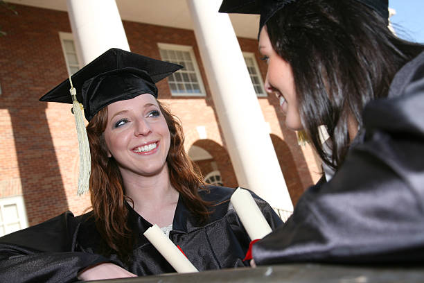 istock Happy Graduate talking with a friend 174650256