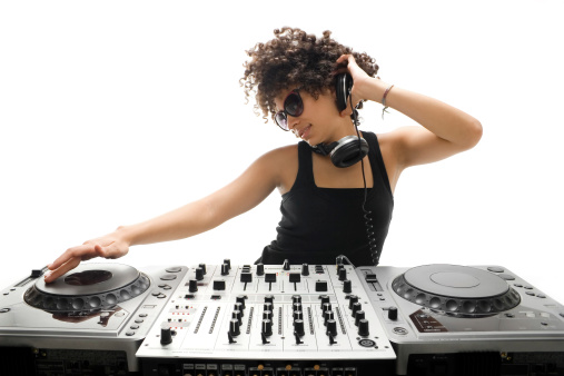 A cute curly haired woman Djing.