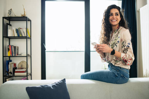 istock Shot of a young woman using her smartphone 1746511222
