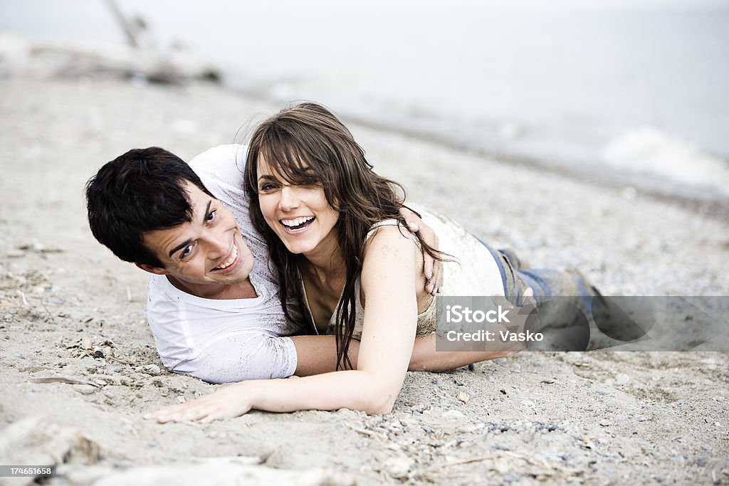 Happiness on the Beach Couple on the beach. More images like this can be found in the model lightbox. 25-29 Years Stock Photo