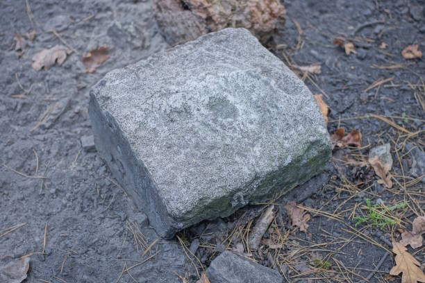 istock one gray square concrete piece lies on the ground 1746530303