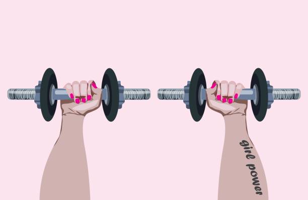 istock Two female hands lifting dumbbells with each hand. Pink nails. Tattoo 