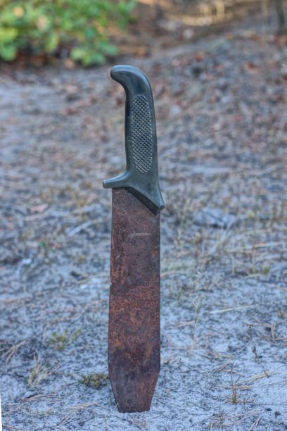 istock one brown rusty big old machete knife in gray ground 1746530631