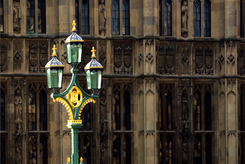 A street lamp seen on Westminster bridge in London catching the early morning sunlight.