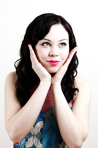 Shot indoors- studio setting/ plain background.
