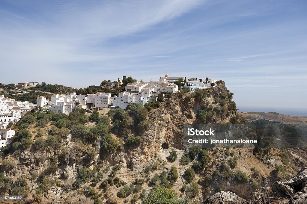 White village of Casares in Andalucia, Spain A view of the white village of Casares near Malaga in Andalucia, Spain. It is built on top of a tall bluff overlooking the countryside. Vejer De La Frontera Stock Photo
