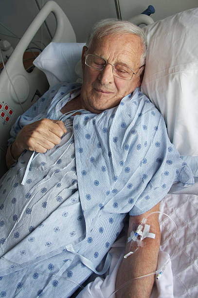 hospital stay for elderly man stock photo