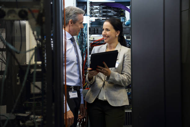 istock IT professionals having meeting in server room 1746539722