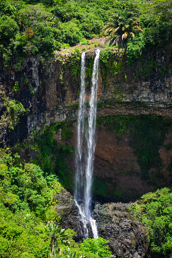 Chamarel waterfall at summer in Mauritius island. Mauritius, an Indian Ocean island nation, is known for its beaches, lagoons and reefs.