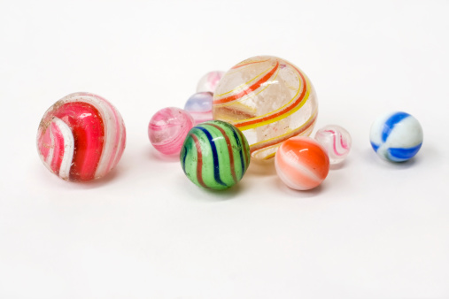Antique, transitional  marbles for children to play with. Multicolored glass balls.