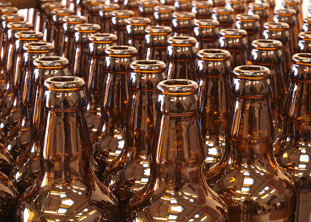 istock Clean, brown beer bottles on production assembly line  174654226