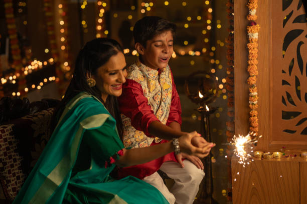 istock Mother with son playing with sparklers at home 1746548205