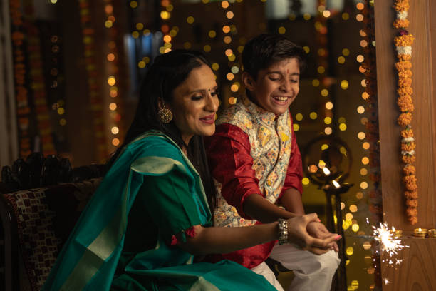 istock Mother with son playing with sparklers at home 1746548867