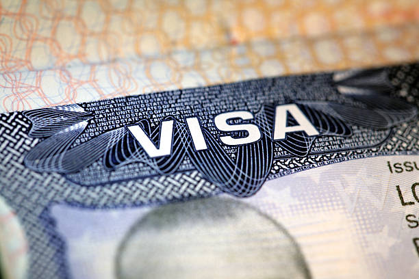 Us Visa macro view of an old US visa passport stamp stock pictures, royalty-free photos & images