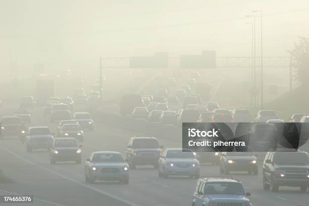 Cars At Rush Hour Driving Through Thick Smog Stock Photo - Download Image Now - Pollution, Smog, Car