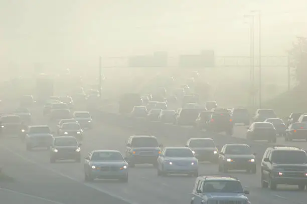 Photo of Cars at Rush Hour Driving Through Thick Smog