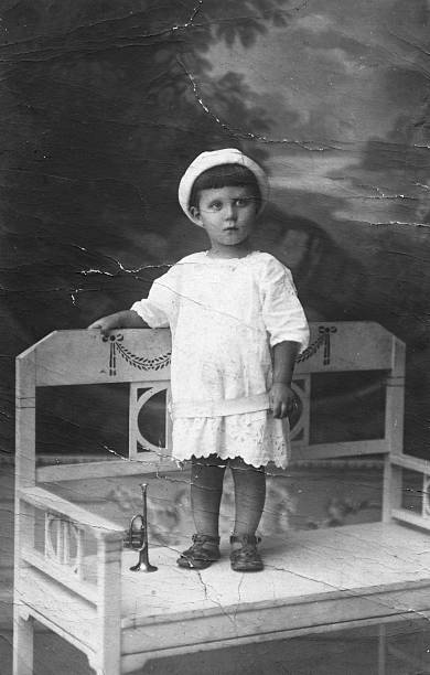 Studio shot of an italian child in 1914.Some scratches and grain.Scanned print.