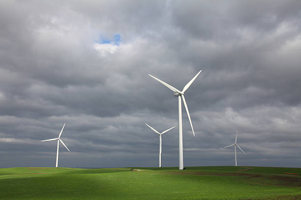 istock Wind Turbines, Stormy Sky and Green Grassland 174656232