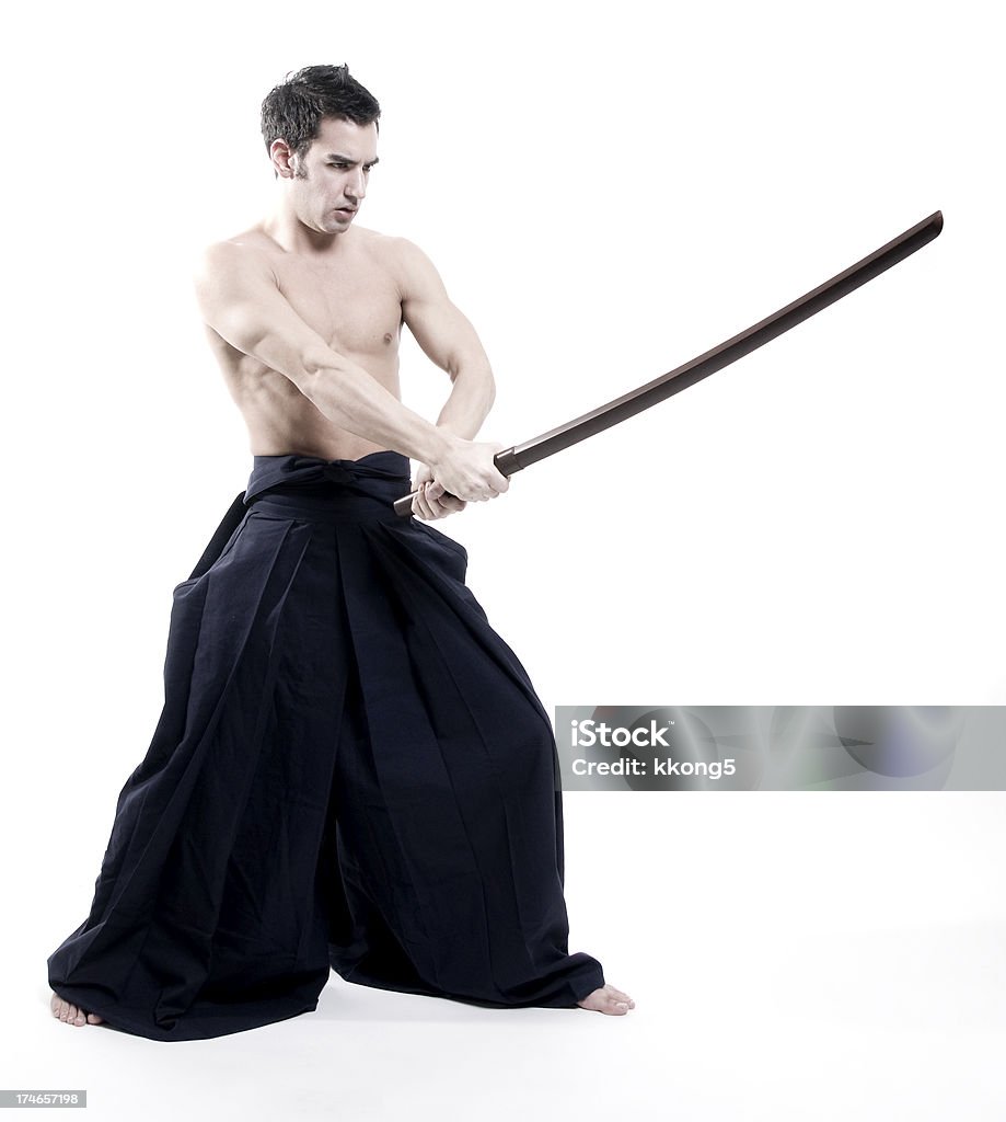 laido artes marciais: Jovem macho com espada usa kendo calça - Foto de stock de Artes Marciais royalty-free