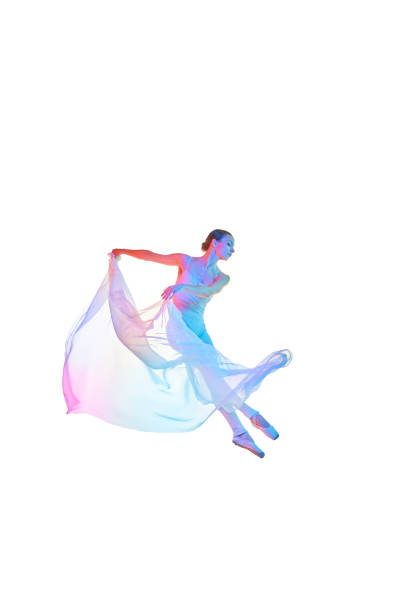 istock Pretty young woman, processional ballet dancer making performance with transparent fabric isolated on white studio background in neon light. 1746581678
