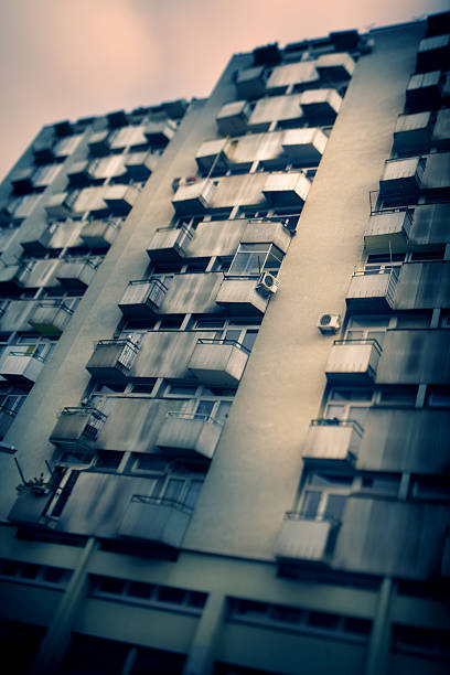 Urban An old apartment building, taken with wide angle tilt shift lens. ljubljana slums stock pictures, royalty-free photos & images