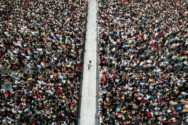 istock Man walking between crowds of people 1746595139
