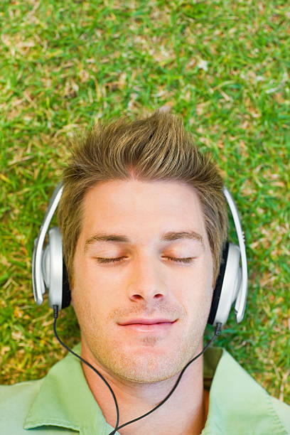 istock Young man listening to music 174659545