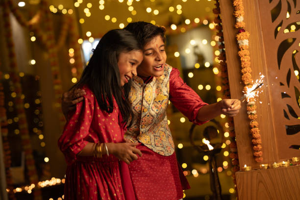 istock Happy siblings playing with sparklers at home during Diwali 1746599057