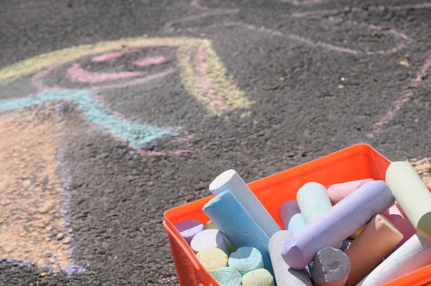 istock kid's chalk drawing on driveway 174659913